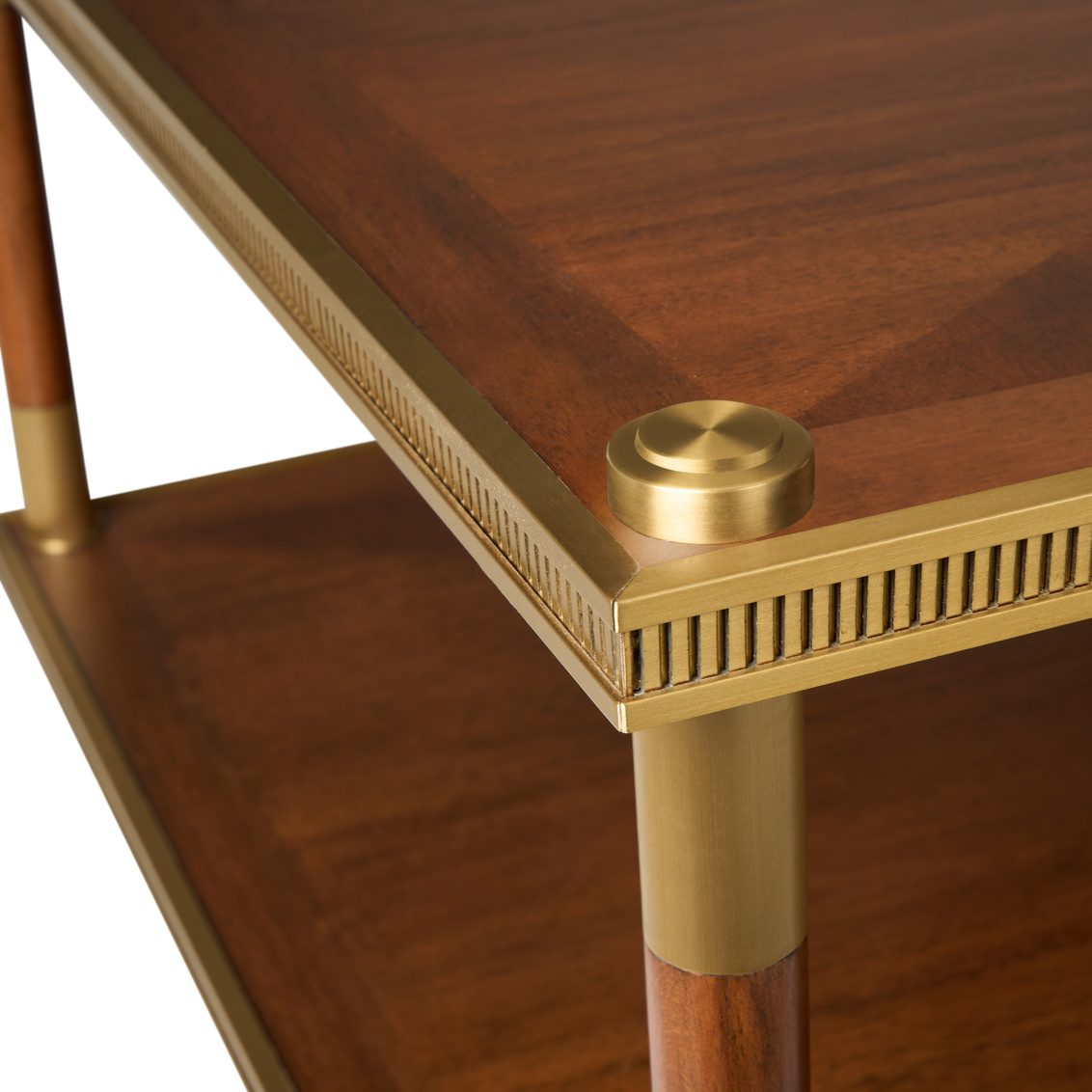 detail of brass accents on a brown wood coffee table