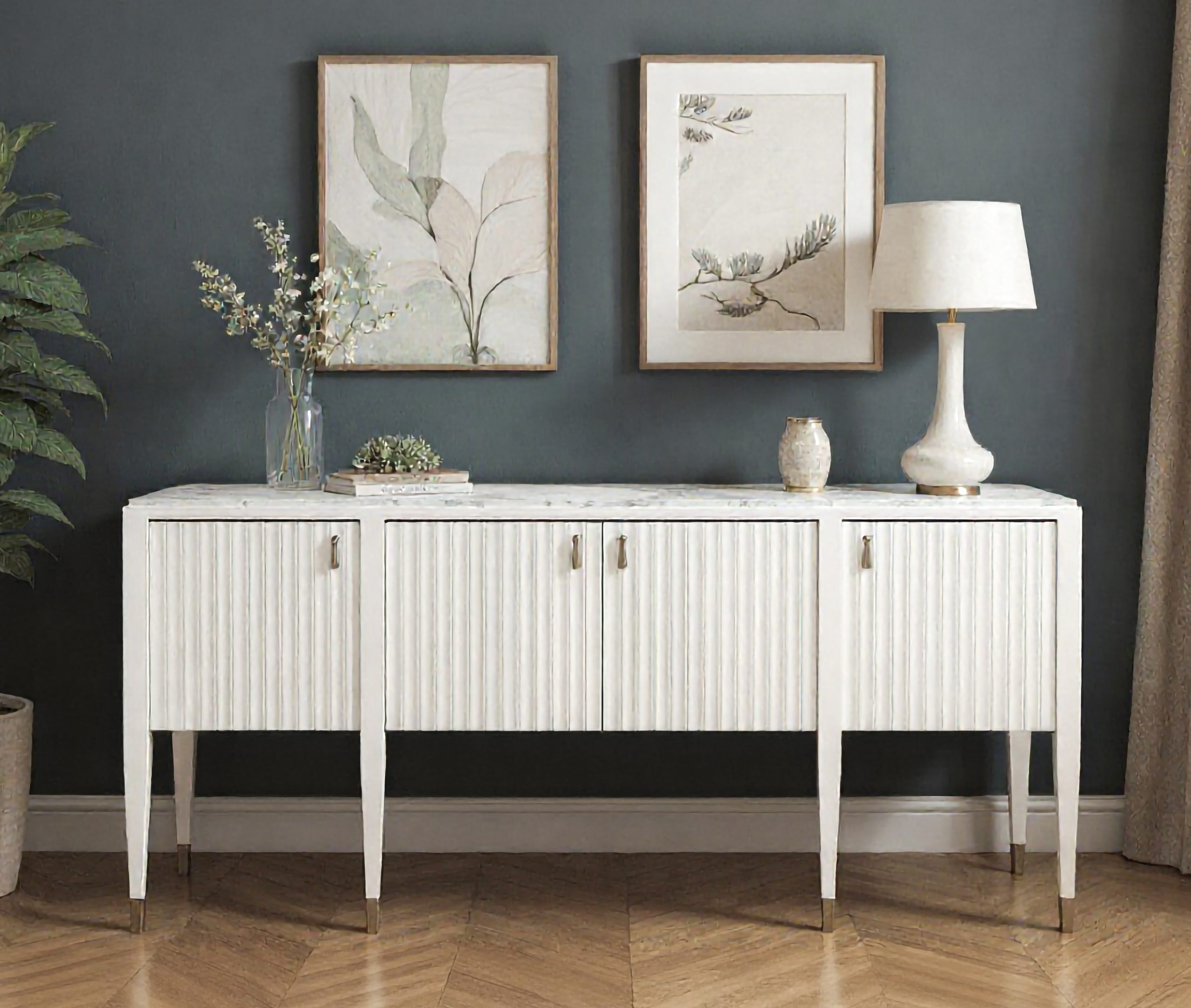 grey painted room with a marble topped white sideboard and neutral art and decorative accessories