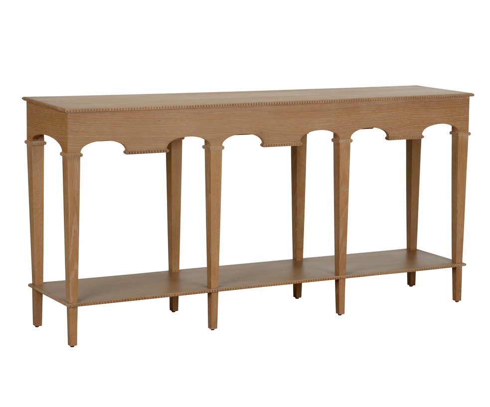 cerused oak console table featuring arched detailing, slender legs, and a spacious lower shelf.