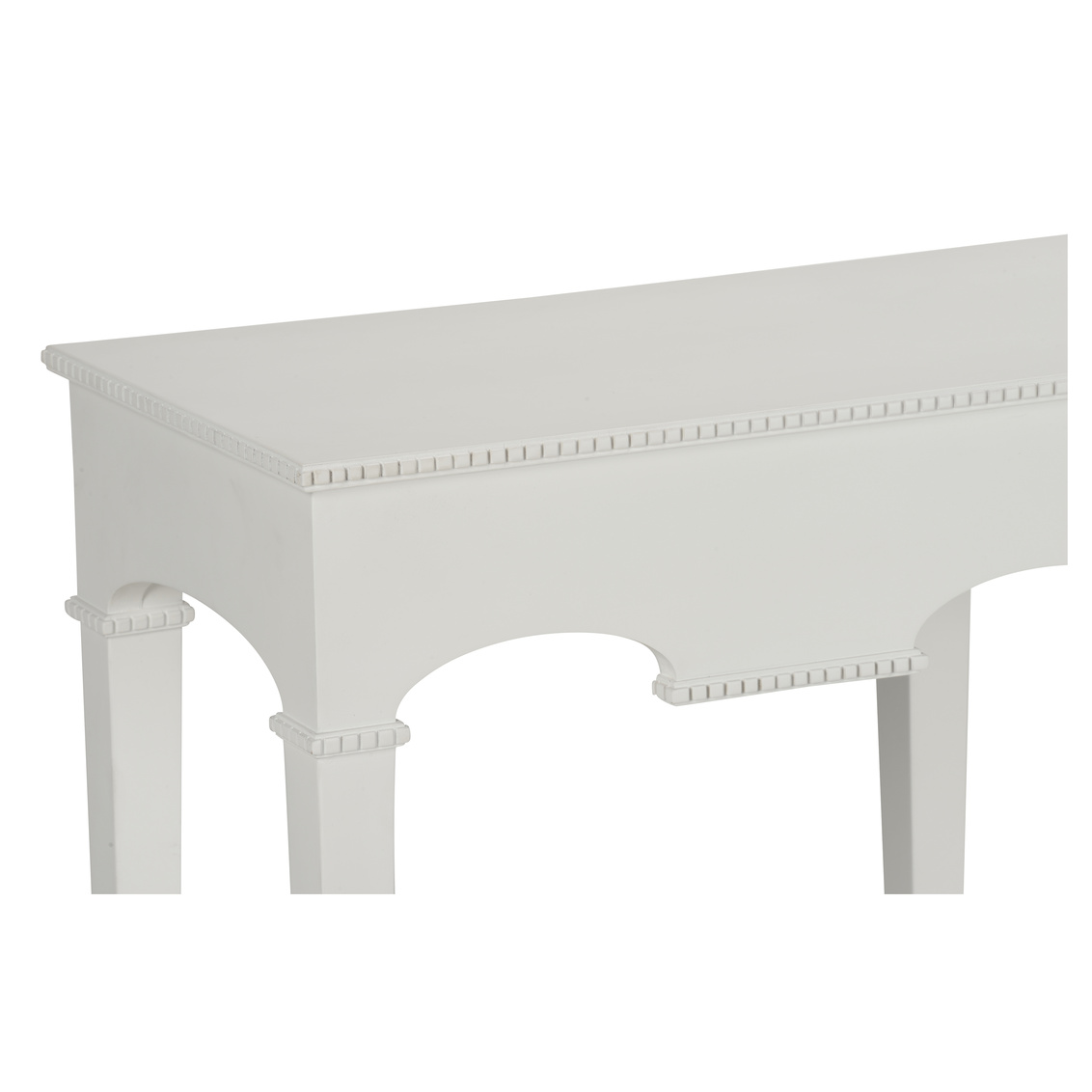 detail of white console with arched detail and subtle beaded molding