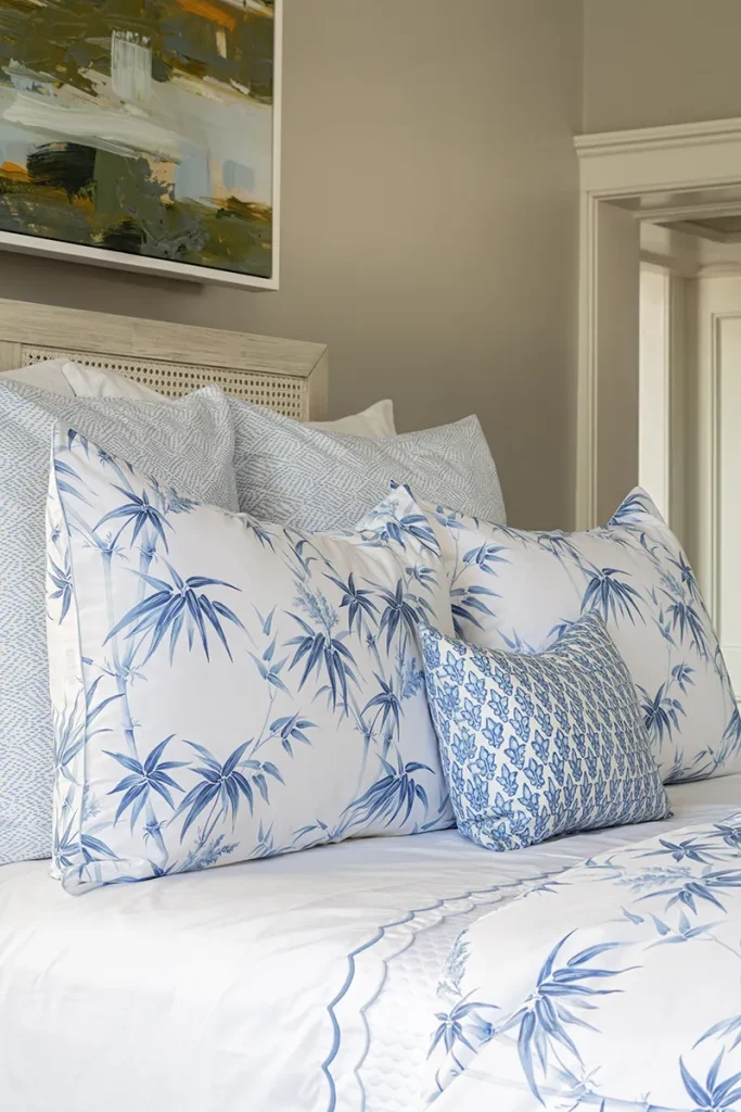 Sheets and pillowcases in a range of patterns and solids on a styled bed with products from GDC Home's bedding stores in Charleston SC